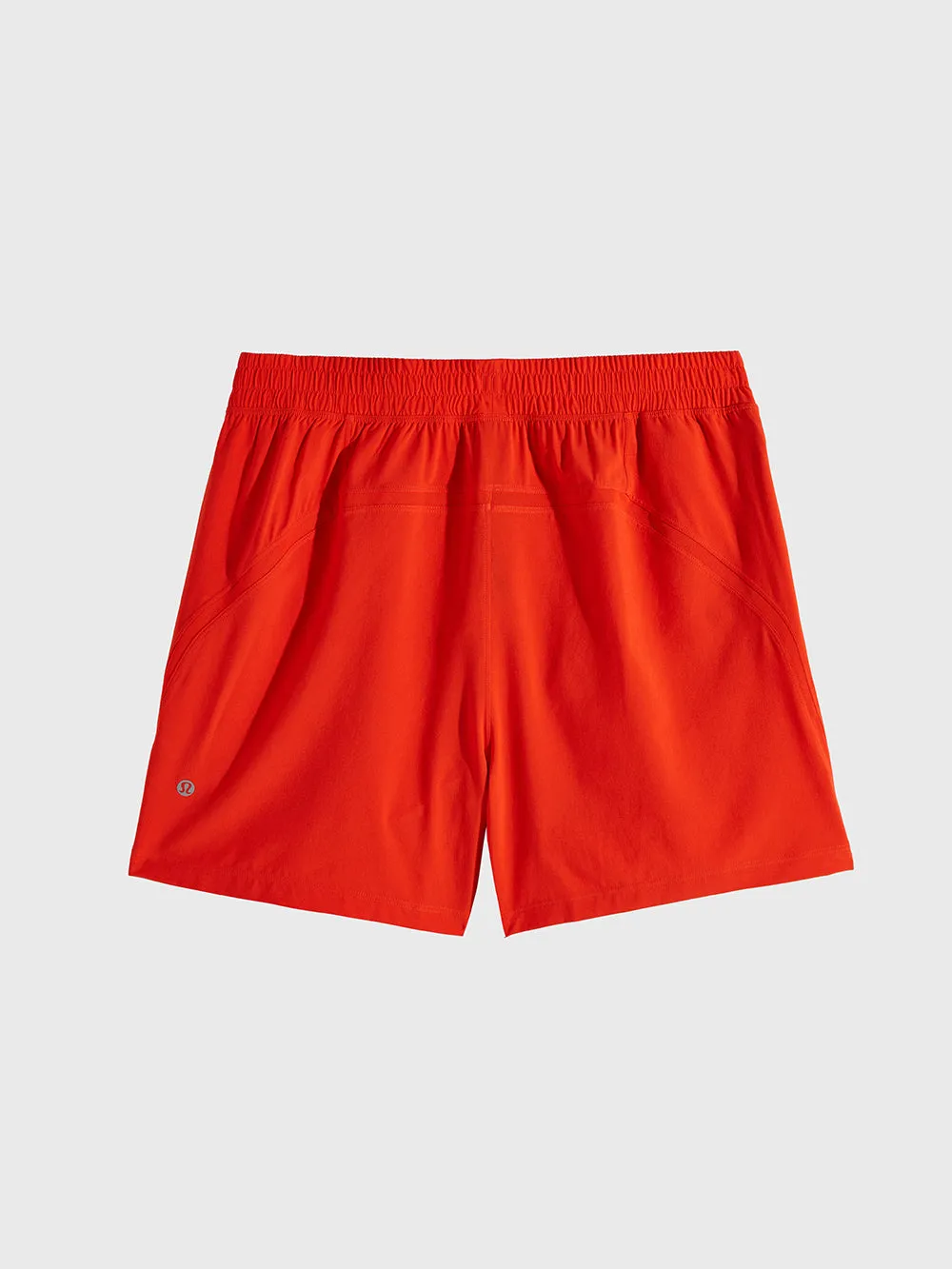 LULULEMON SOLAR ORANGE PACE BREAKER LINERLESS 5IN SHORT